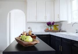 Although the name makes it sound like the cabinets are black and white, tuxedo cabinets can be any combination of light and dark. Tuxedo Kitchen Redesign Remodelista