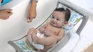 This is how we bathe babies in the nicu and they love baths. Baby S Journey Bath Hammock Fish Friends Youtube