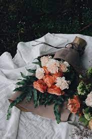 How your smile makes my heart skip a beat and how every time i'm with you, i feel complete.” featured bouquet: Orange And Pink Petaled Flower Bouquet On Table Photo Free Flower Image On Unsplash