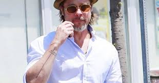 Not all of brad pitt's tattoos are visible, and this reportedly new tattoo pitt has on his stomach is still relatively unknown. Brad Pitt S 10 Tattoos Their Meanings Body Art Guru