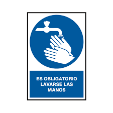 Aprende qué determina una señal como obligatoria: Una estación de primeros auxilios con la señal de obligación M019 (Lavarse las Manos) cerca, demostrando la aplicación de la definición oficial de señalización de mandato.