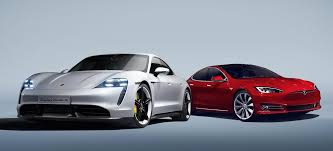 Birds up close, taycan turbo s way in the distance. Tesla Model S Stood Next To Porsche Taycan