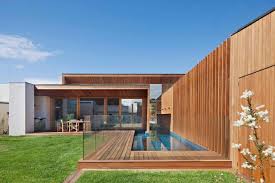 A sectional under the windows, a table by the doors, and a central tv that can. The Villa At Barwon Heads An L Shaped Breezy And Spacious Beachside Retreat By Bower Architecture Caandesign Architecture And Home Design Blog