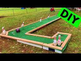 For this backyard golf course, i just scrounged through my recycling bin for odds and ends like cardboard boxes, tin cans, aluminum pie plates, and 2 liter plastic pop bottles. How To Build A Mini Golf Course In Your Backyard Youtube