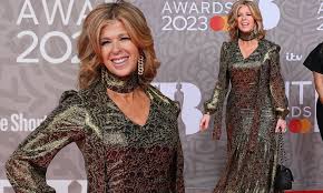 Kate Garraway looks elegant in a plunging gold gown at The BRIT Awards 2023  | Daily Mail Online