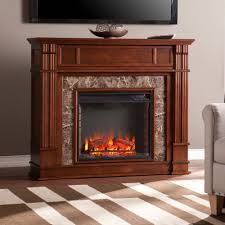Crisp white finish highlights subtle woodwork; Highgate Faux Stone Electric Media Fireplace Whiskey Maple Southern Enterprises Fe9321