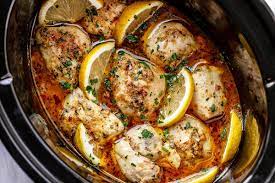 Pork tenderloin simmers in onion soup and red wine that's flavored with garlic and soy sauce. Crock Pot Chicken Thighs Recipe With Lemon Garlic Butter Easy Crockpot Chicken Recipe Eatwell101