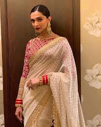 Ivory And Red Deepika Padukone Is A Vision In A Jamdani Sari Edged With Gold Zardozi Lace And A Full Sleeved Tulle Zardo Saree Look Stylish Sarees Saree Trends