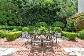 Brick patios with circular patterns create a subtle bullseye effect that can be charming or quite intriguing, as shown by the modern patio below. Red Brick Patio Ideas Diy Paver Designs Pictues