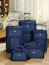 If you're travelling alone, then look for a set of two suitcases, one of which should be the right size for hand luggage. Homechoice Wall Street Navy Luggage Set Luggage Luggage Sets Wall Street