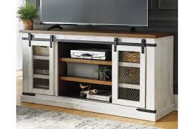 When considering entertainment centers for your decorating plan, think about the overall style and color first. Wystfield 60 Tv Stand Ashley Furniture Homestore
