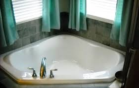 The combination of light marble floor tiles, natural stone wall tiles and white metro tiling helps the copper effect tiles around the tub stand out furthermore. What Is A Garden Tub The 2021 Garden Tub Guide Badeloft