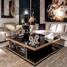 This distinctive table features an iron frame complemented by a marble top and shelf. Black Gold Cocktail Table Taylor Llorente Furniture