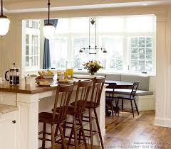 Kitchen Idea Of The Day This Luxury Kitchen Features A Window Seat Banquette Along W Dining Nook Kitchen Design Traditional White White Kitchen Traditional