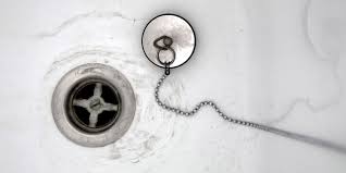 Then twist and pull until you feel it hook onto the baffle. How To Clean Drains And Unclog Shower Or Sink Drains Today