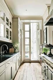 Light shades on cabinets, painted walls, and other surfaces will make the kitchen feel larger. 25 Functional Galley Kitchens With Pros And Cons Digsdigs