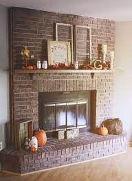 Brick is usually seen in traditional or rustic spaces but with a sleek treatment, it looks right at home in a contemporary design. Amazing 15 Log Ideas To Make Rustic Home Decor Https Kidmagz Com 15 Log Ideas To Make Rust Red Brick Fireplaces Brick Fireplace Decor Fireplace Mantle Decor