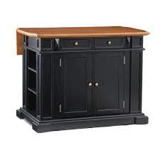 They are usually placed in the centre of the kitchen, and are functional additions that provides extra counter space and storage. Homestyles Americana Black Kitchen Island With Drop Leaf 5003 94 The Home Depot