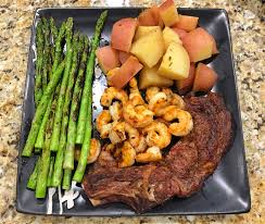 Cook potatoes in large pot of boiling salted water until just tender, about 15 minutes. Homemade Grilled Ribeye Garlic Butter Shrimp Grilled Asparagus And Boiled Rosemary Red Potatoes Food