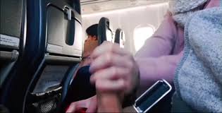Handjob on a Plane Near People - ThisVid.com