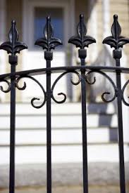 On the west side of the house, behind the driveway, there is a. Spanish Fencing Styles