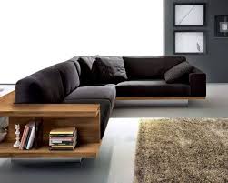 Living Rooms Minimalist Living Room With L Shaped Black Sofa Feat Book Storages Near Fluffy Rug Livin Wooden Sofa Designs Sofa Couch Design Modern Sofa Designs