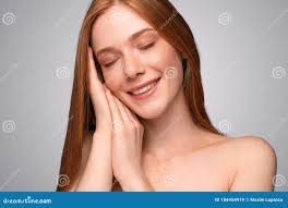 Delighted Ginger Model with Hands Under Cheek Stock Image