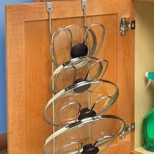Put The Inside Of Your Cabinet Doors To Work Too Storing Pot Lids Or Hiding Your Trash Can Small Apartment Organization Storing Pot Lids Tiny Apartments