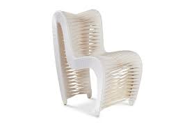 A lot of people recognize this phillips collection chair from the hunger games, but it is also one of 20 chairs currently on display at theater art galleries in high point for the chair as art. Seat Belt Off White Dining Chair