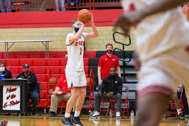 Photos: East beats Harlem, 59-50. Wins second NIC-10 title in three years.