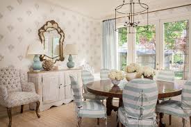 Chair with tubular metal base with black finish; Shabby Chic Dining Room With Stripe Slip Cover Chairs Distressed Wood Cabinet And White Hydrangea Centerpiece Hgtv