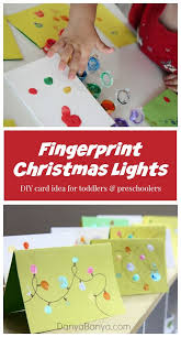 Toddlers and preschoolers can make these cards with very little assistance, while older kids can be strategic about the placement of their gem ornaments on their doily trees. Christmas Lights Cards From Kids Fingerprints Danya Banya Homemade Christmas Cards Preschool Christmas Diy Christmas Cards