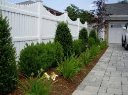 Pin By Chrissie Troy On Backyard Ideas In 2021 Fence Landscaping Vinyl Fence Landscaping Fence Design