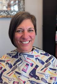 Amy's embracing a bold new look with this sassy asymmetrical haircut.