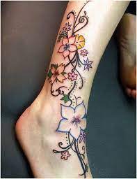 Love How The Flowers Are Done On This Tattoo My Next Tattoo Will Have Minimal Black Outline Ankle Tattoos Ankle Tattoo Designs Leg Tattoos