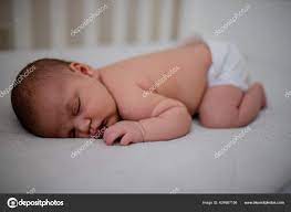 Newborn Baby Girl Sleeping Face Down In Her White Cradle Stock Photo By C Kanelbulle 424667156