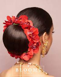 Red Orchid Faux Blooms For The Traditional Bride Blooms Red Orchid Full Gajra Hair And Makeup Jaine Braided Bun Hairstyles Big Bun Hair Bun Hairstyles