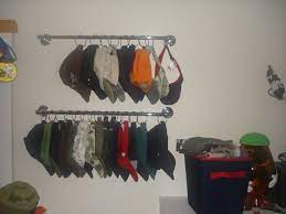 Shelf dividers or bookends help keep stacks. Get Cozy And Clean Room With Creative Hat Rack Ideas Pros Cons Hat Organization Hat Storage Hat Rack