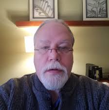 Who is the young man holding a bowling ball in the 1970s photo at 9G Lanes?
