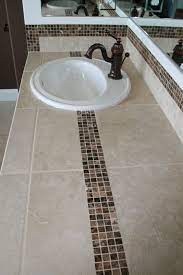 Read about all the bathroom countertop materials that are available and which ones are most widely used. Pin By Abbey Carpet Floor Of Puyall On Our Work Bathroom Countertops Tiled Countertop Bathroom Bathroom Countertop