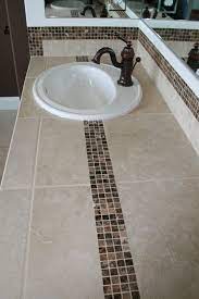 Bathroom remodels can be so expensive! Pin By Abbey Carpet Floor Of Puyall On Our Work Tiled Countertop Bathroom Bathroom Countertops Bathroom Countertop