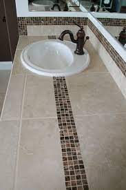 _ the mirror lighting is just amazing! Pin By Abbey Carpet Floor Of Puyall On Our Work Bathroom Countertops Tiled Countertop Bathroom Bathroom Countertop