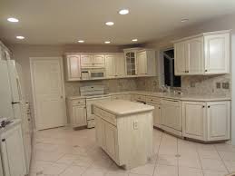 After removing the hardware, we recommend that the cabinets be thoroughly cleaned with a good cleaner degreaser to remove all grease and oils that normally buildup on kitchen cabinetry over time. Faux Painting Cabinets Kitchen Traditional With Contemporary Chandeliers Light