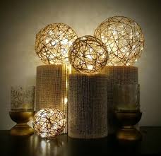 Jute Twine Lantern Balls With Twinkle Fairy Lights Copper Wire On Display Columns Made From Books Crafted Diy Twine Orbs Diy Crafts For Home Decor Twine Diy