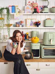 This unique modern kitchen combines black and stainless steel appliances for an invigorating lookirresistible kitchen with black appliances ideas decohoms image result for sage green kitchen cabis with black. Drew Barrymore Debuts New Line Of Retro Inspired Kitchen Appliances