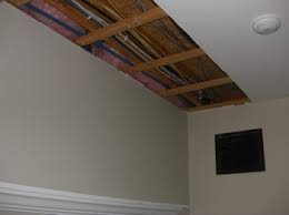3 set drywall sheet onto the drywall lift, then crank it up to the ceiling. Basement Ceiling Choices Part Ii Which Type Of Ceiling Best Suits A Basement Drop Ceiling Or Drywall Rescon Basement Solutions