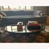 The clean silhouette is enhanced by the hammered forged iron frame in an antiqued bronze finish. Crate Barrel Clairemont Oval Coffee Table Aptdeco