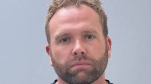 Plastic surgeon charged with manslaughter after wife's post-surgery death,  officials say