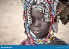 Mursi Girl with Rich Head Decoration Editorial Photography