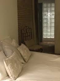 Leave one of the walls in the bathroom to be with bricks. First Floor West Double Room With Glass Brick Wall Of Bathroom In The Background Picture Of Aux Jardins Des Thevenets Espinasse Vozelle Tripadvisor
